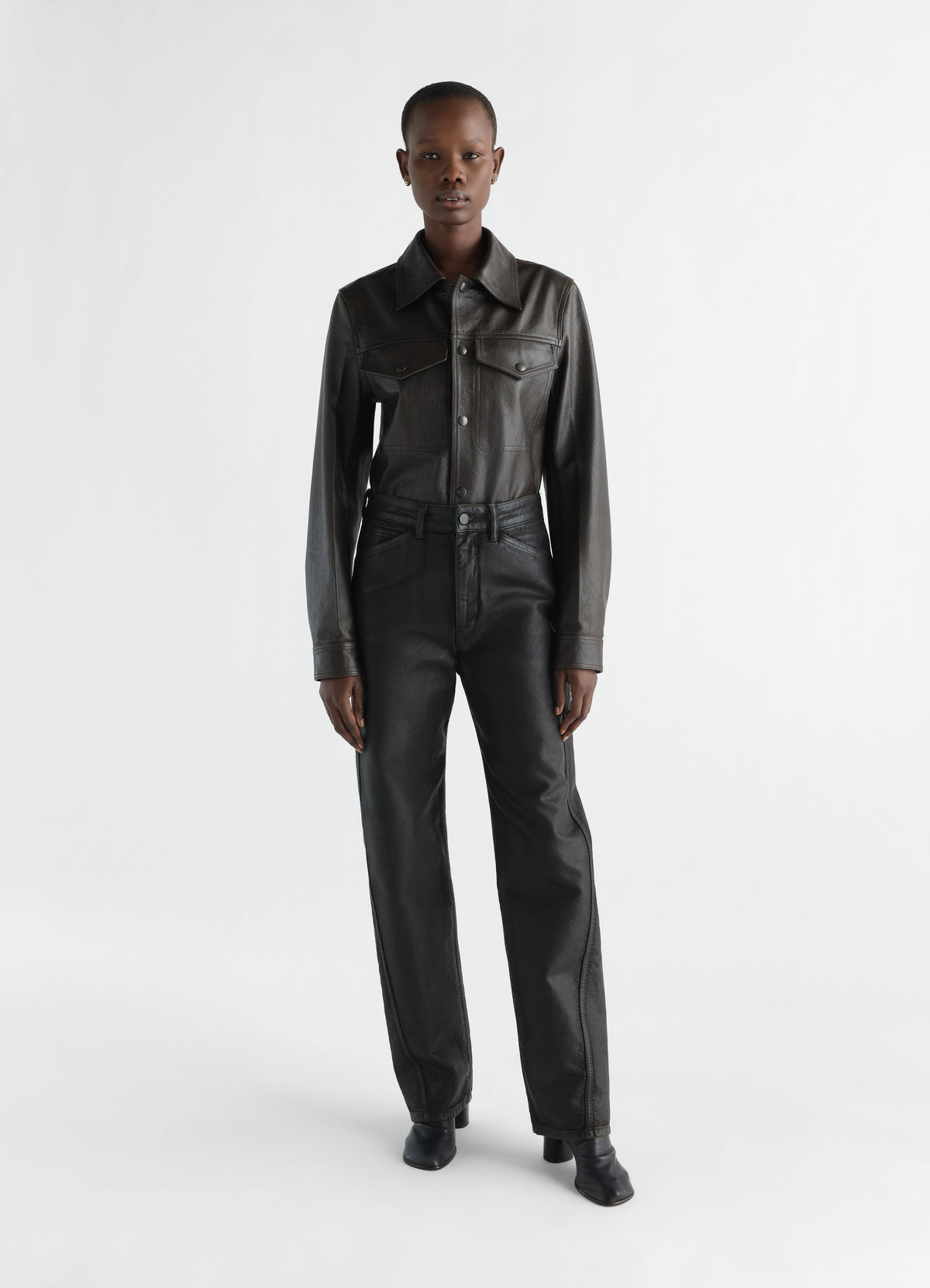 FIVE POCKETS TWISTED PANTS IN COATED DENIM